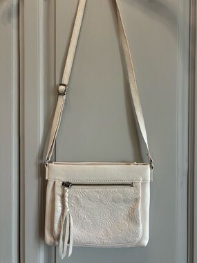 The Sak Sanibel White Floral Boho Embossed Leather Crossbody w Tassel - Cream